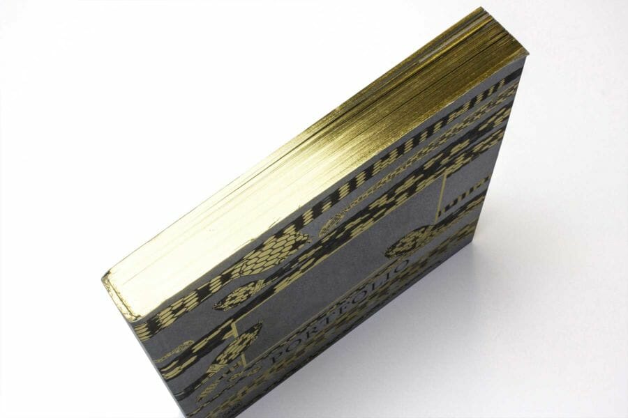 Edge gilding - A technique that allows the outer edges of a book to be coloured using traditional palettes as well as fluorescent and metallic colours.